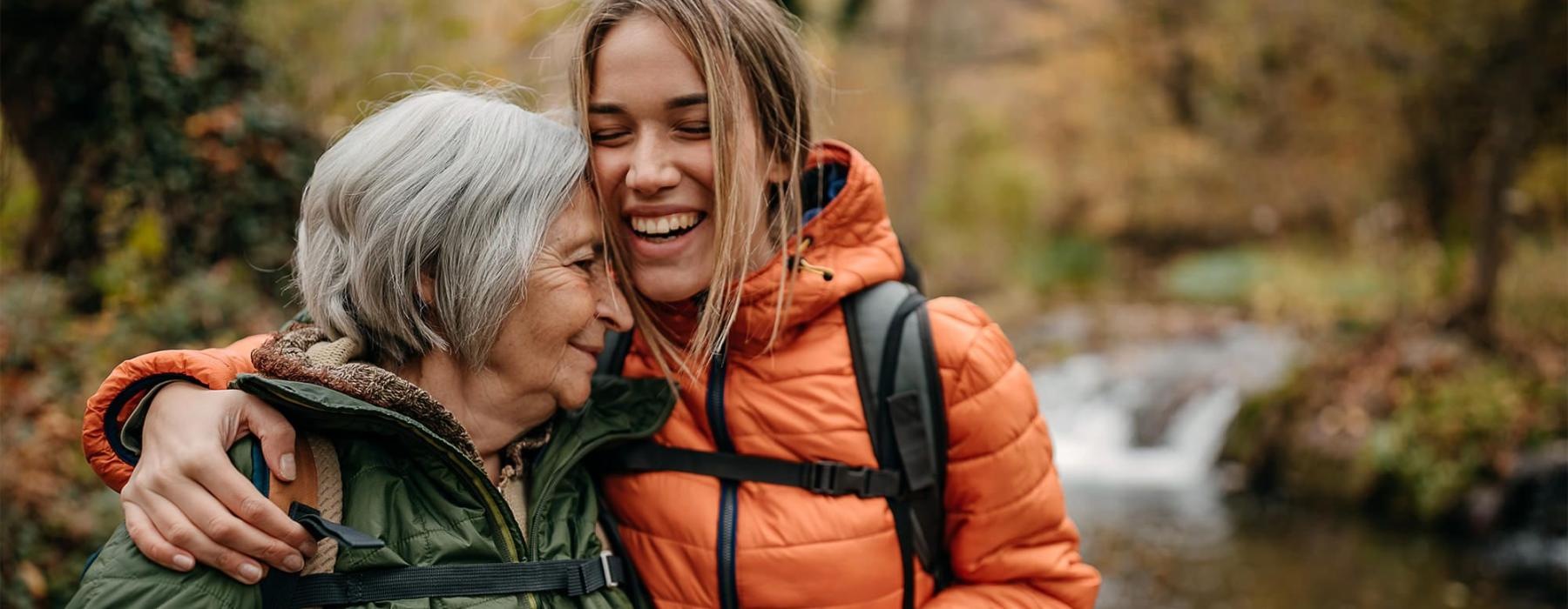 a couple of women smiling while hiking